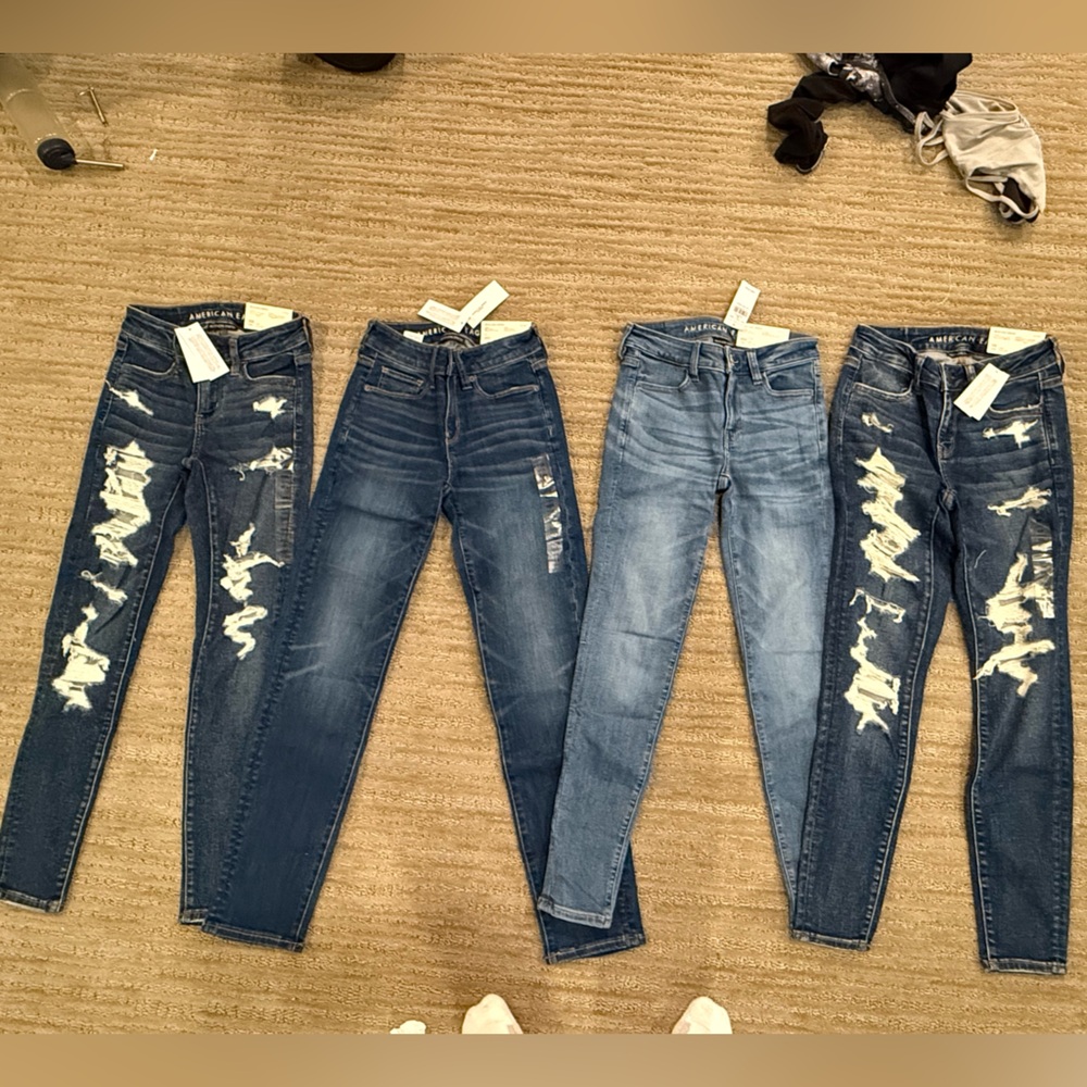 4 pairs of American Eagle jeans